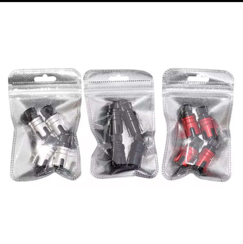 Two sets of Quick Offroad Tire Deflation Valves in black, and red for offroad tire pressure control.