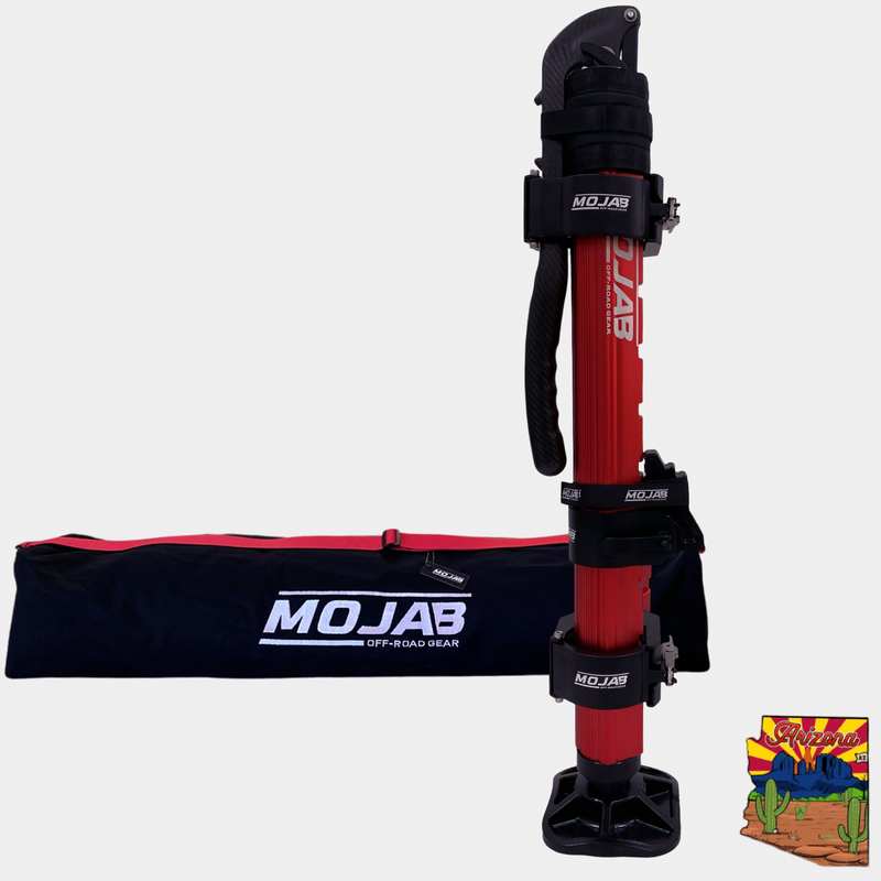 CarbonPro Hydraulic Jack in red with black mounting clamps and carrying bag for off-road use