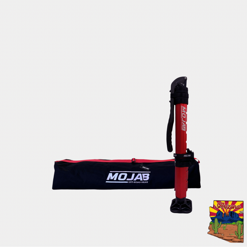 Red CarbonPro SXS Hydraulic Jack with lightweight carbon fiber handle and black Mojab storage bag for off-road use