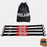 Set of four 2" x 39'' heavy-duty nylon axle tie-downs with integrated rings and storage bag for secure vehicle transport.