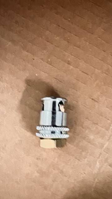 Set of 4 female 1/4 inch NPT connection lock on air chucks on cardboard background